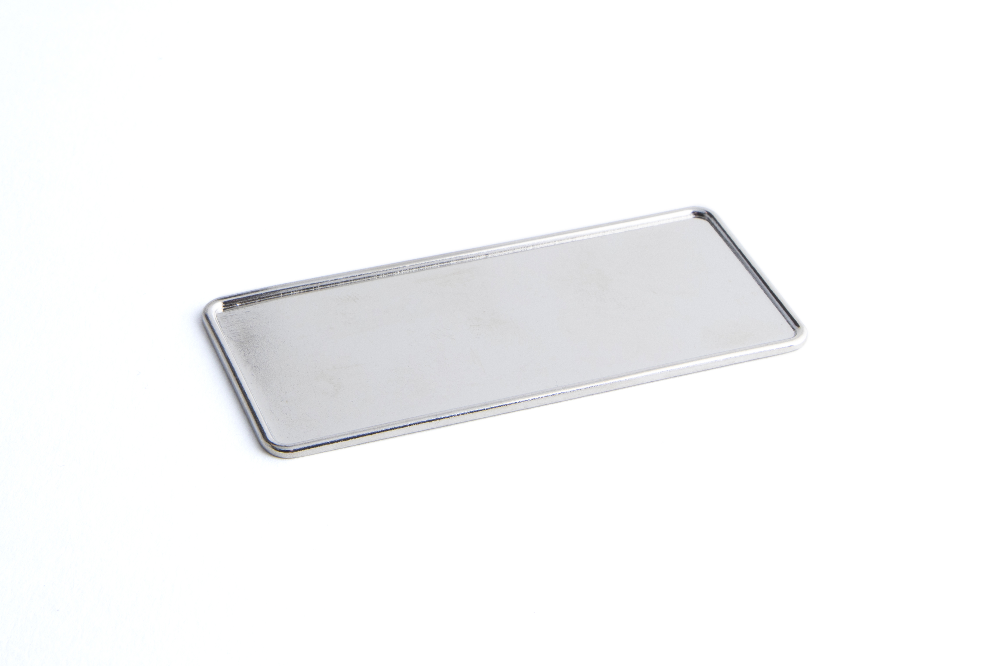 76 x 32 mm Metal Badge Frame with raised edge Nickel Plated **From £8.00/100** 